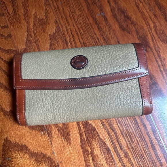 Dooney & Bourke Handbags - Dooney & Bourke wallet tan pebbled leather and trimmed with brown leather